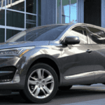 Silver 2020 Acura RDX In front of building