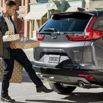 Couple Loading Presents into 2019 Honda CR-V Cargo Area