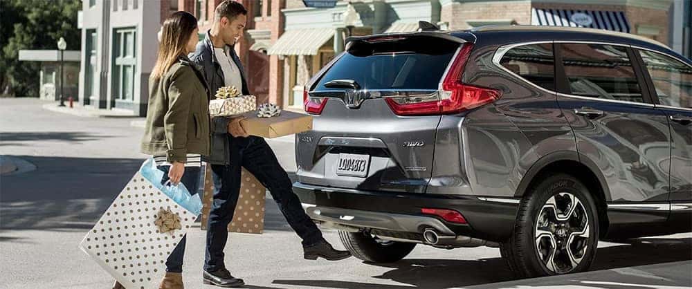 Couple Loading Presents into 2019 Honda CR-V Cargo Area