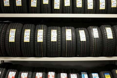 a rack of tires at a car dealership
