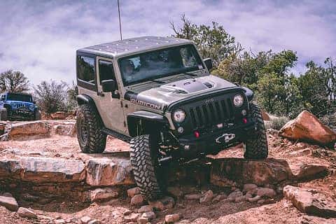 Grey Jeep Wrangler SUV going offroad