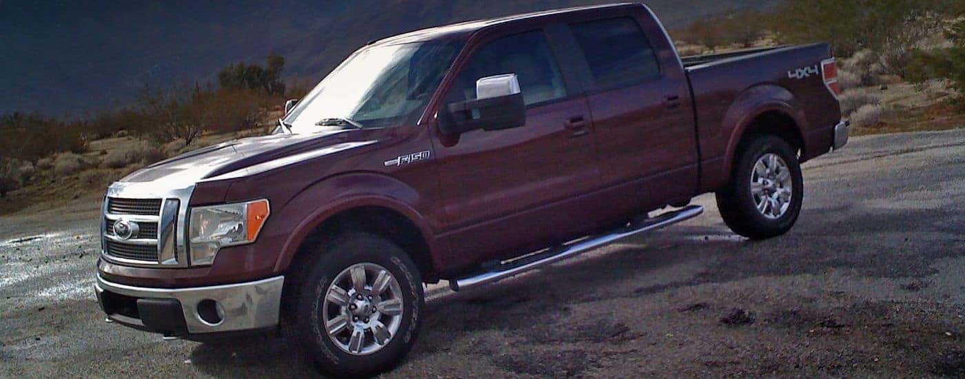 Red 2009 Used Ford F-150 on the mountains