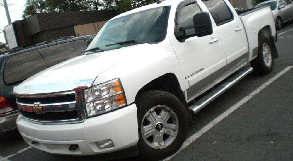 White 2010 used Chevy Silverado in a parking lot