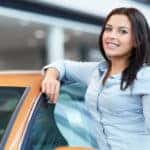 A young women gets her used car online with a no credit car loan