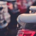 The trunks of parked cars in a no credit car lot in Indianapolis are shown.
