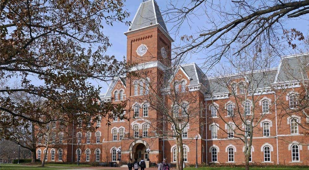 Students walking toward a brick building at Ohio State University