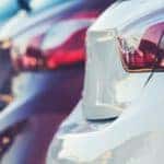 A row of certified pre-owned cars is shown.