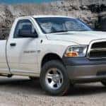 A white 2012 Ram 1500 is in a canyon.