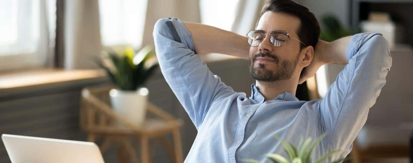 A man is shown sitting peacefully.