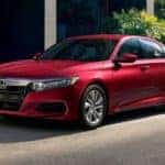 A red 2020 Honda Accord LX is shown parked on a city street.