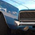 A close up shows the grille of a 1970 Dodge Charger.