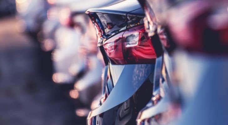 A row of a car trunks is shown at a University City online car dealer.