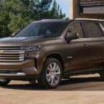 A brown 2021 Chevy Tahoe is shown from the front at an angle after the owner searched for 'Dallas online car sales'.