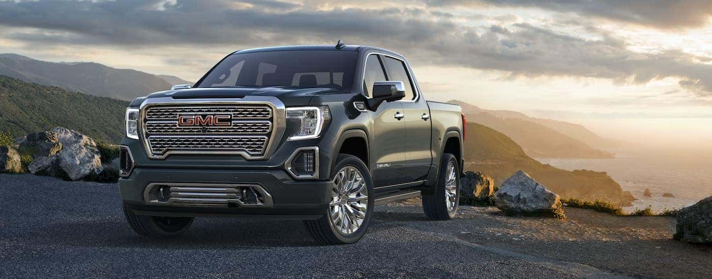 A grey 2019 GMC Sierra 1500 Denali is shown overlooking the ocean.