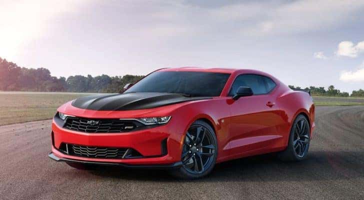 A red 2020 Chevy Camaro SS is shown from the front after leaving a dealer that handles Detroit car sales.