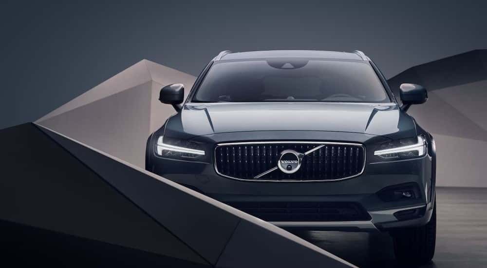 A 2023 Volvo V90 Cross Country is shown in a modern setting.