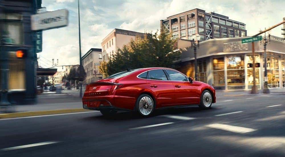 A red 2022 Hyundai Sonata is shown from the rear at an angle.
