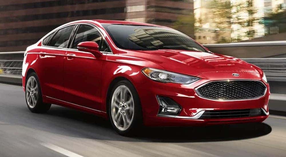 A red 2020 Ford Fusion is shown from the front at an angle after leaving a dealer that handles St. Louis car sales.