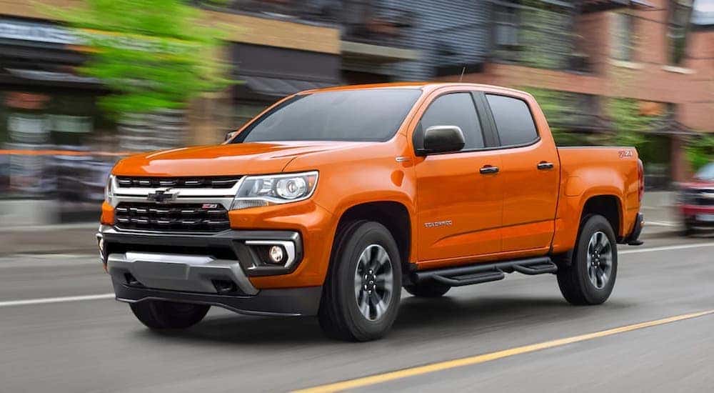 A orange 2021 Chevy Colorado Z71 is shown from the front at an angle.