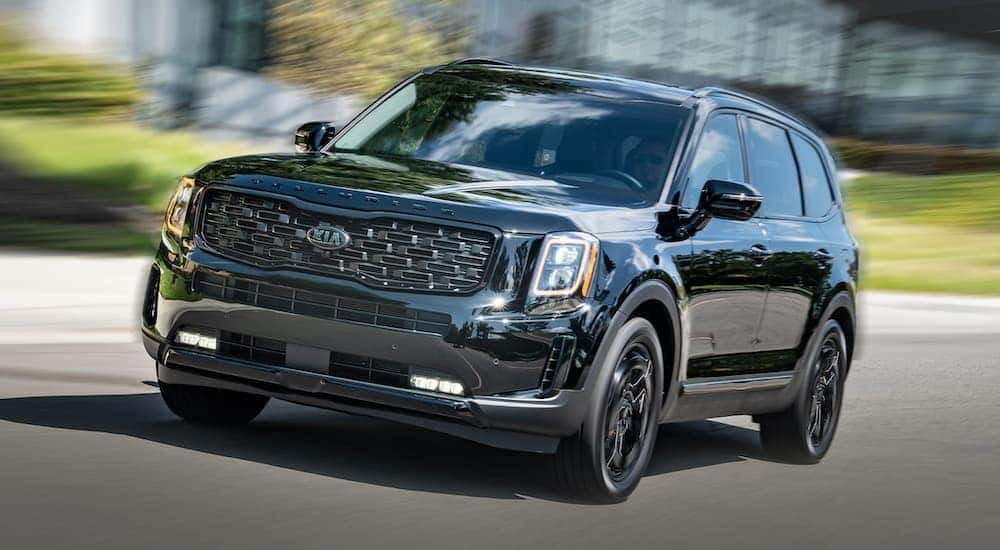 A black 2021 Kia Telluride is shown from the front after leaving a dealer that handles Jacksonville car sales.