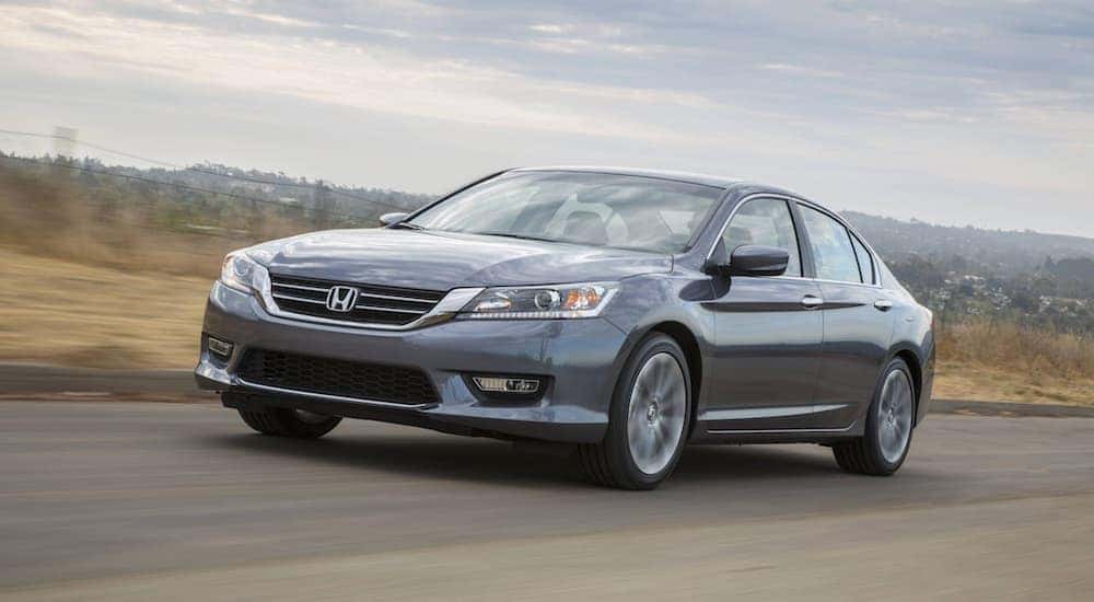 A silver 2015 Honda Accord is shown from the front at an angle.