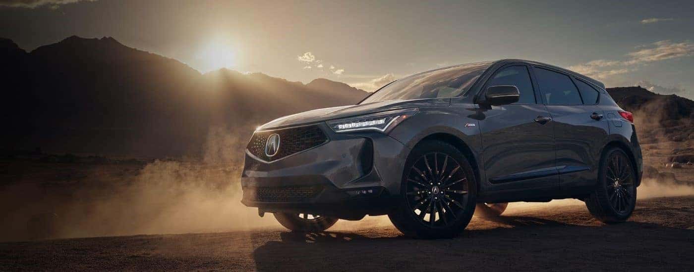 A grey 2022 Acura RDX A-Spec is shown from the side on a sunny day.