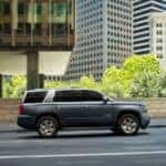 A grey 2020 Chevy Tahoe Premier Plus is shown from the side after looking at cars for sale in Minneapolis.