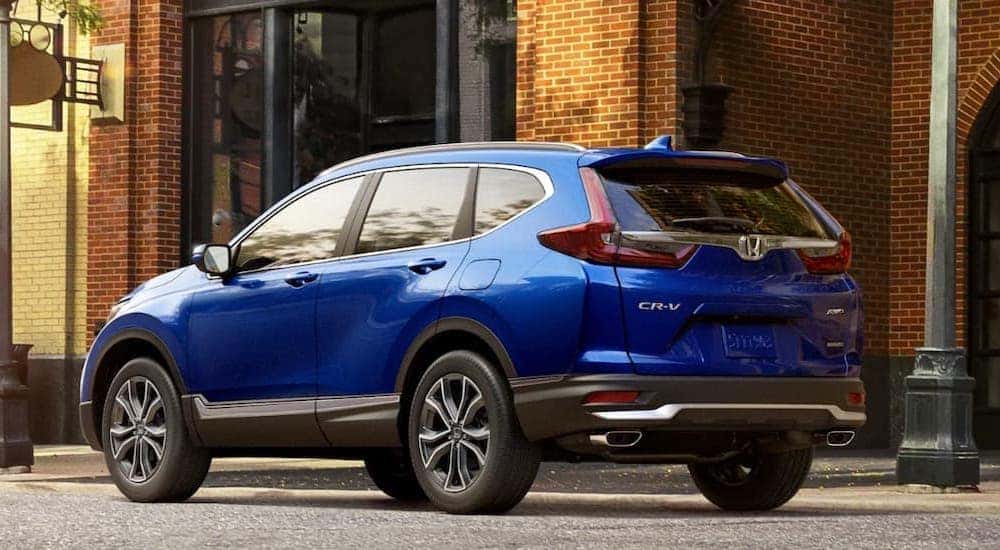 A blue 2020 Honda CR-V is shown from the rear at an angle after leaving a dealer that has cars for sale in Buffalo.