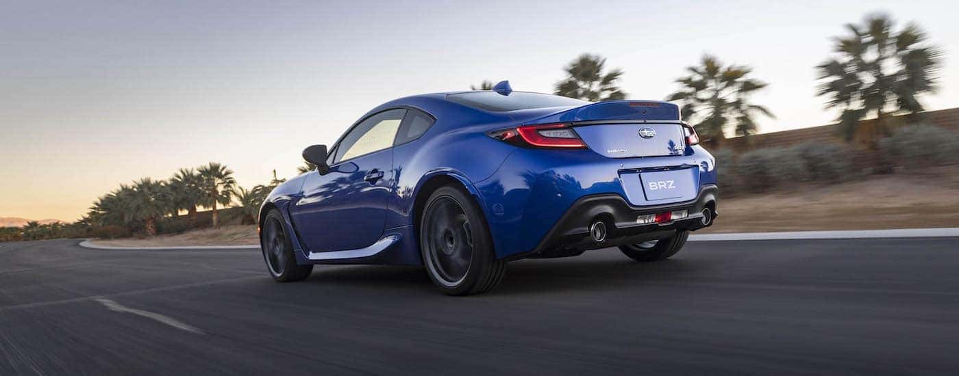 A blue 2022 Subaru BRZ is shown from the rear at an angle.