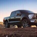 A black 2022 Ford F-150 is shown from the front at an angle.