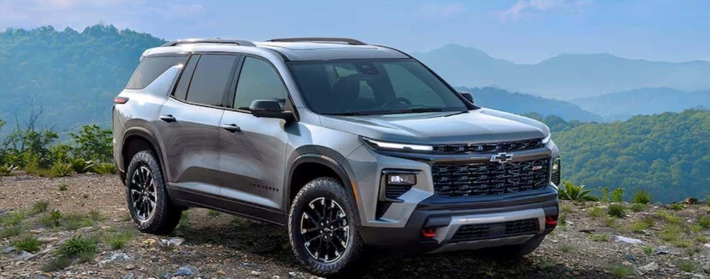 A silver 2024 Chevy Traverse Z71 is shown parked off-road.