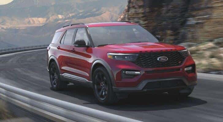A red 2021 Ford Explorer ST is shown from the front at an angle after leaving a dealer that handles Nashville SUV sales.