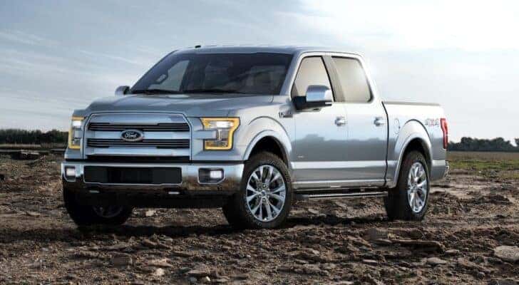 A silver 2015 Ford F-150 is shown from the front at an angle after leaving a dealer that handles Nashville truck sales.