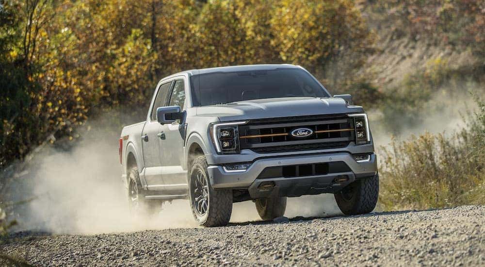 A silver 2021 Ford F-150 Tremor is shown from the front at an angle after leaving a dealer that handles Nashville truck sales.