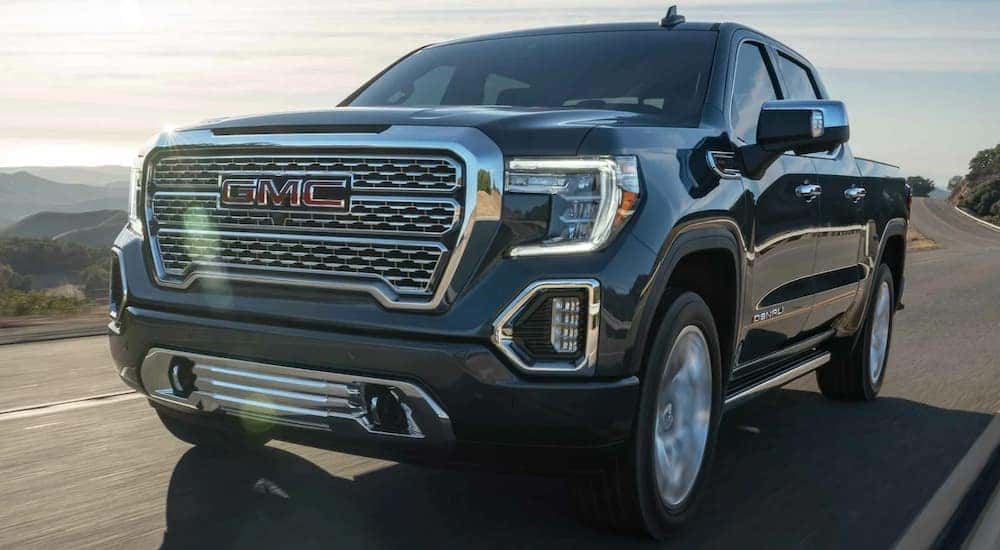 A grey 2021 GMC Sierra 1500 is shown from the front at an angle.