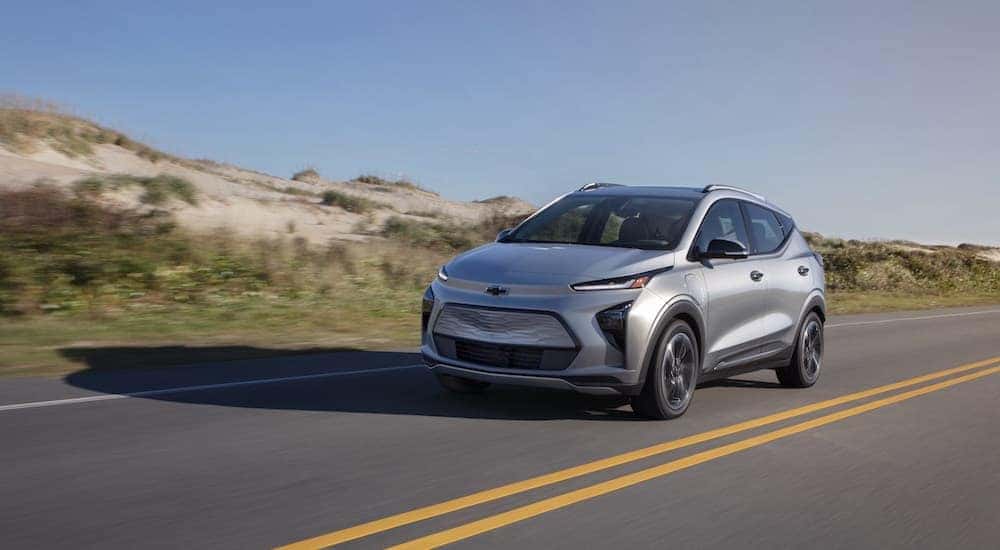 A silver 2022 Chevy Bolt EV for sale is shown from the front at an angle.