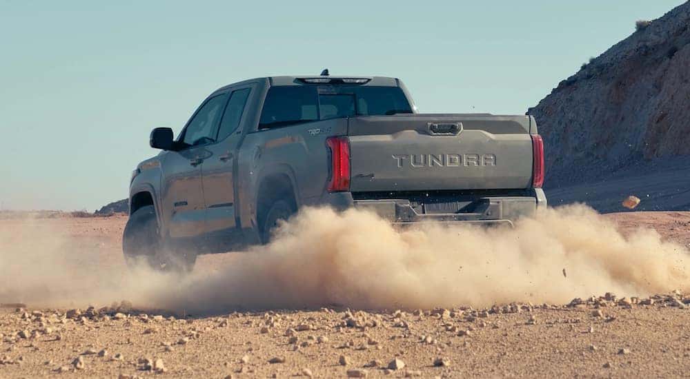 A grey 2022 Toyota Tundra TRD is shown from the rear at an angle.