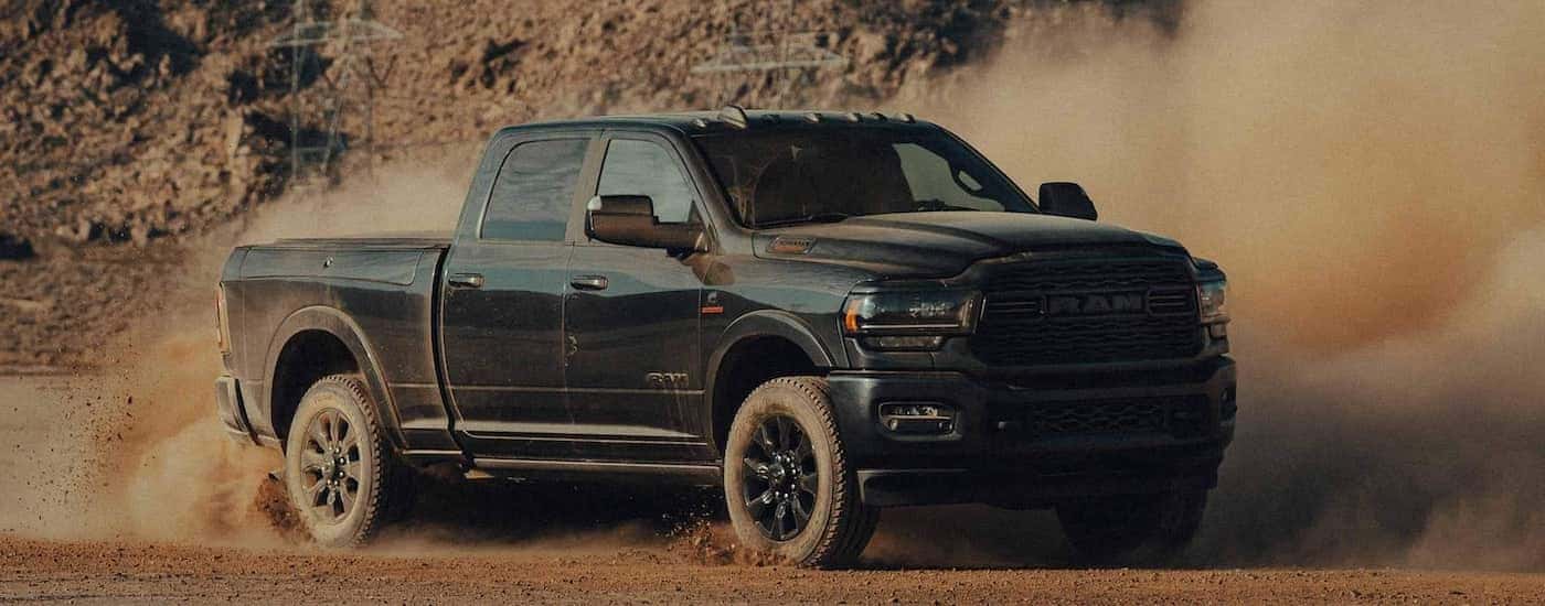 A black 2022 Ram 2500 Cummins is shown from the front at an angle.