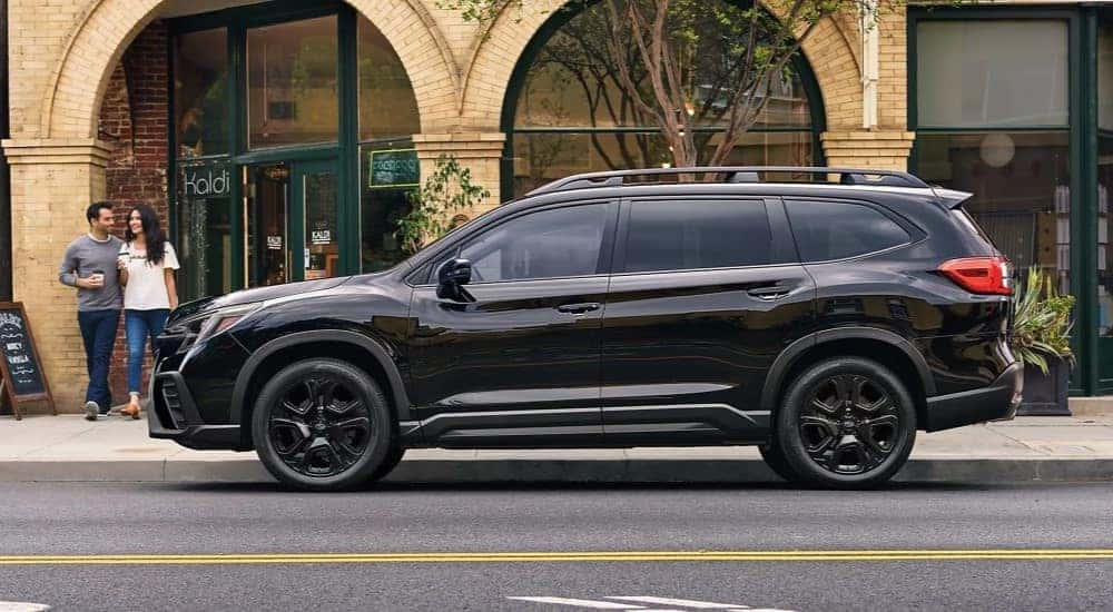 A black 2023 Subaru Ascent is shown at a coffee shop after looking at Nashville car sales.