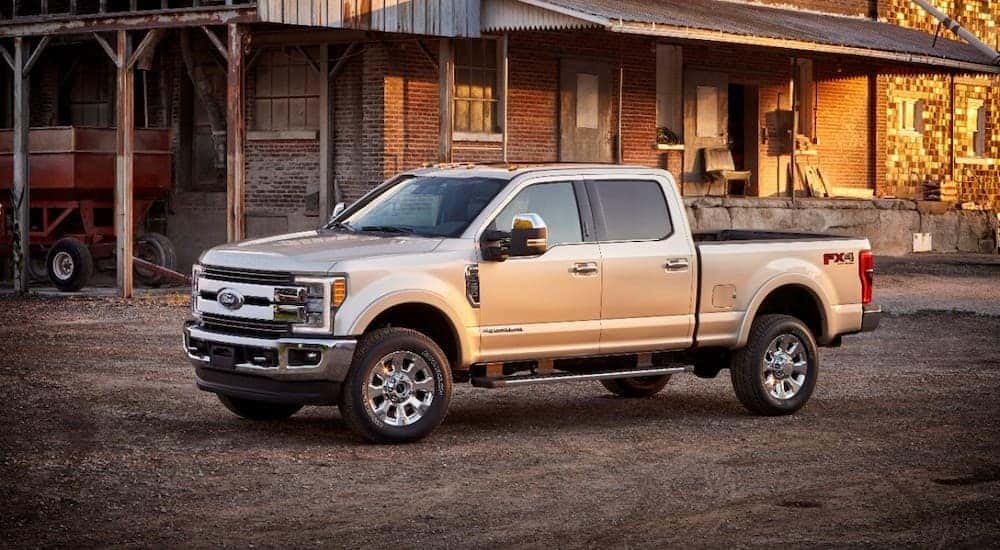 A silver 2017 Ford F-350 Super Duty King Ranch is shown from the side while parked.
