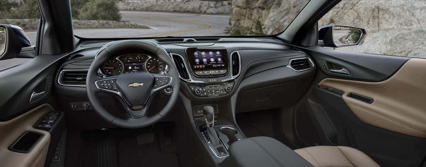 The black interior of a 2023 Chevy Equinox is shown.