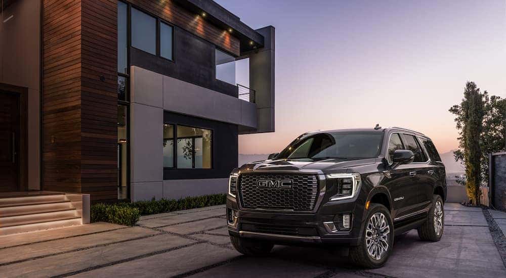 A black 2023 GMC Yukon Denali Ultimate is shown from the front at an angle after leaving a dealer that handles Cincinnati SUV sales.
