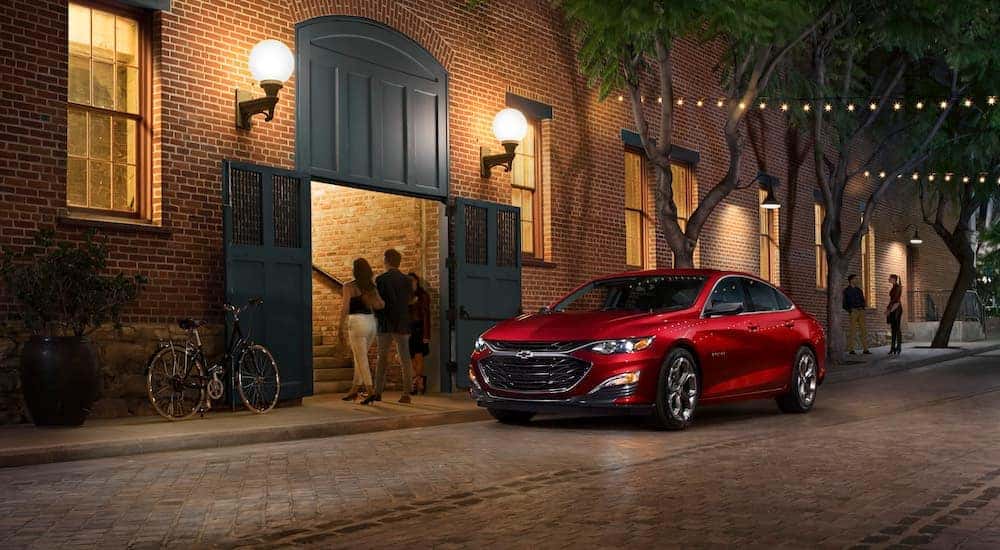 A red 2022 Chevy Malibu is shown from the front at an angle.
