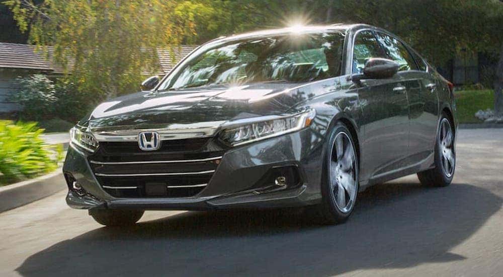 A grey 2021 Honda Accord is shown from the front at an angle.