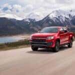 A red 2022 Chevy Colorado Trail Boss is shown from the front at an angle after browsing Dayton truck sales.