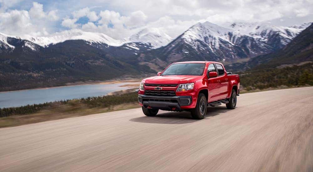 A red 2022 Chevy Colorado Trail Boss is shown from the front at an angle after browsing Dayton truck sales.