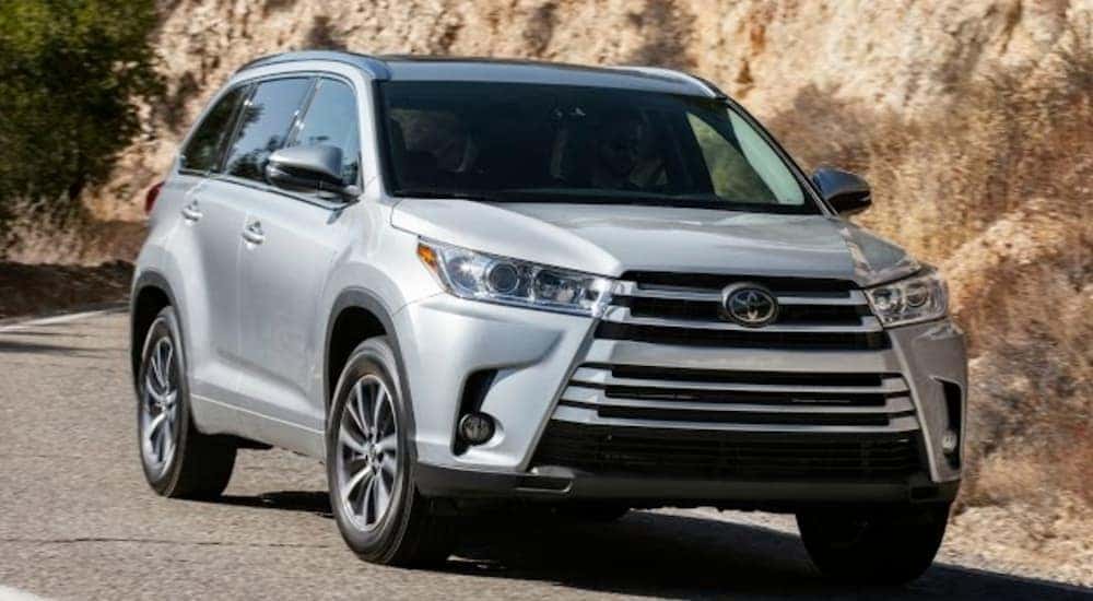 A silver 2017 Toyota Highlander is shown from the front at an angle.