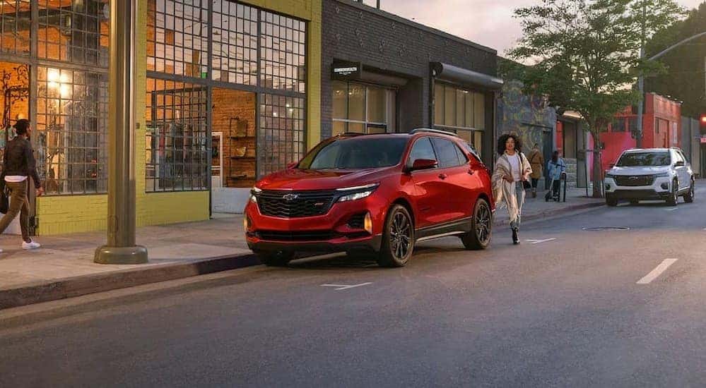 A red 2024 Chevy Equinox RS is shown parked after viewing Columbus SUV sales.