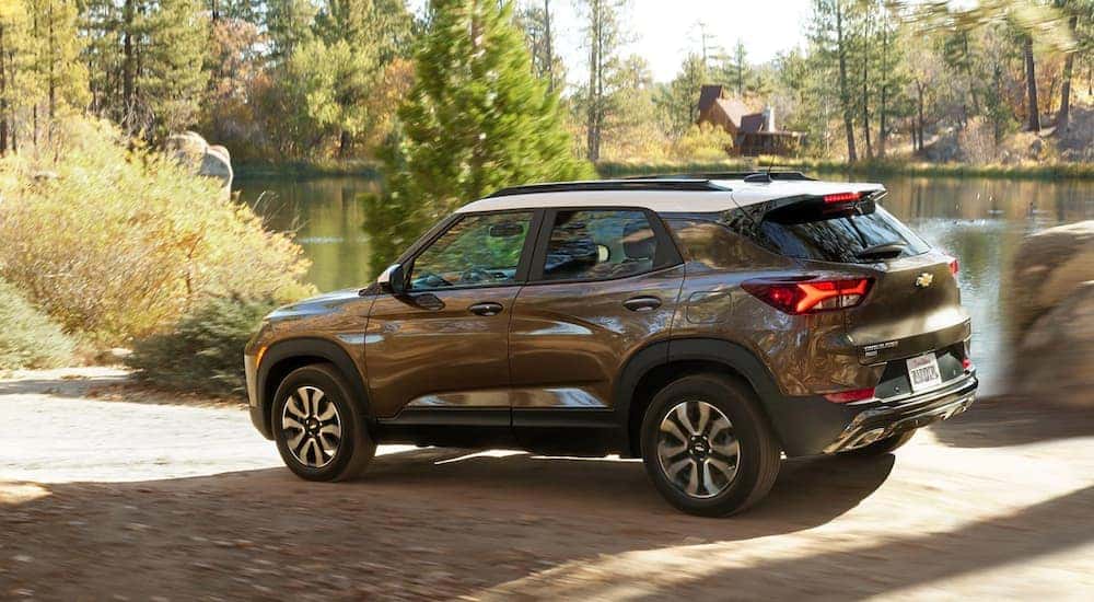 A brown 2021 Chevy Trailblazer is shown parked near a lake.