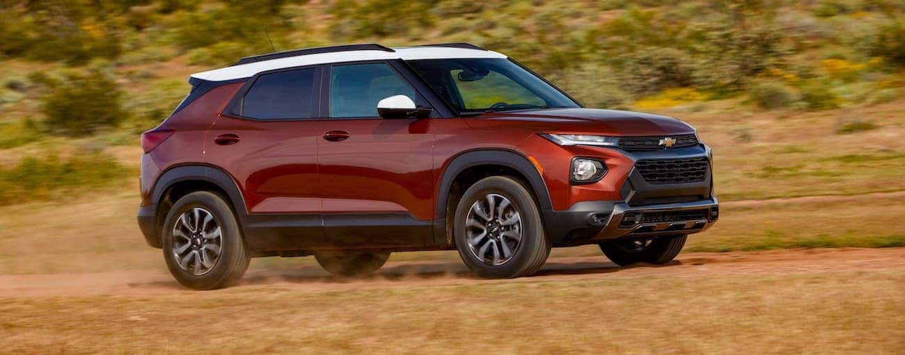A red 2021 Chevy Trailblazer driving on a trail.